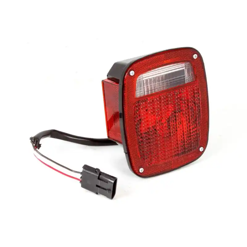 Omix Tail Light LH 98-06 Jeep Wrangler TJ While Supplies Last